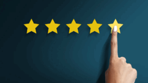 five stars with a finger pointing to the last star